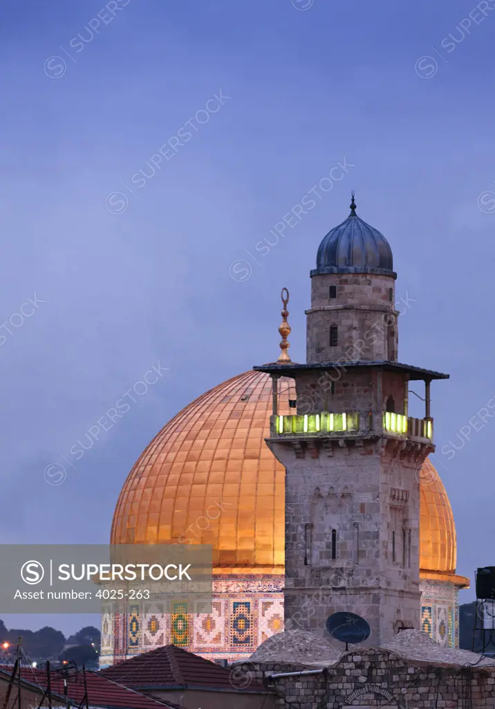 Minaret illuminated in front of the mosque at dusk, Dome Of The Rock, Temple Mount, Jerusalem, Israel