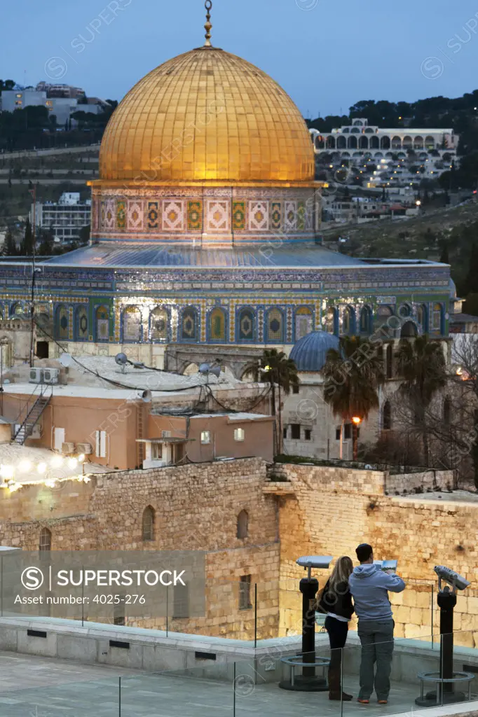 Couple at an overview of the Wailing Wall and Dome Of The Rock at dusk, Temple Mount, Jerusalem, Israel