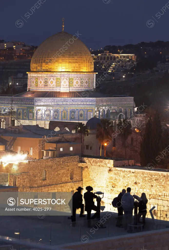 People looking at Wailing Wall and Dome Of The Rock at dusk, Temple Mount, Jerusalem, Israel
