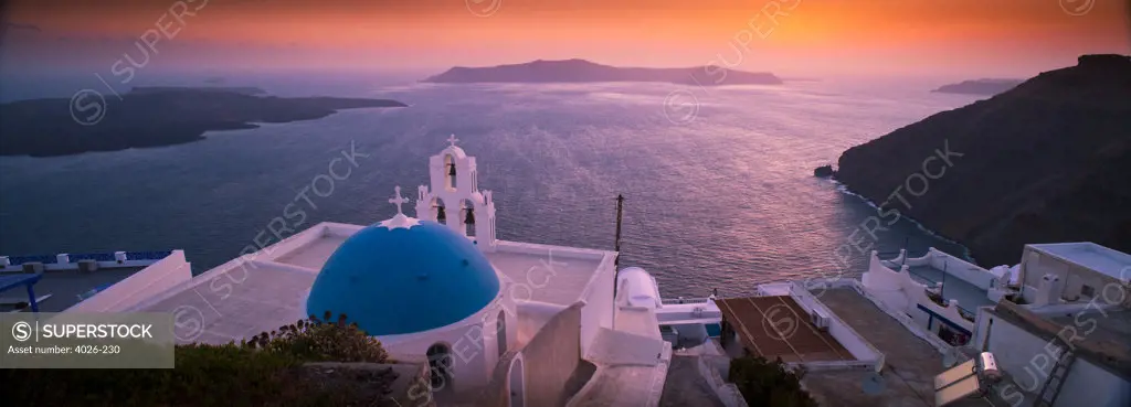 Greece, Cyclades, Santorini Island, Firostefani, Church dome and bell tower at sunset