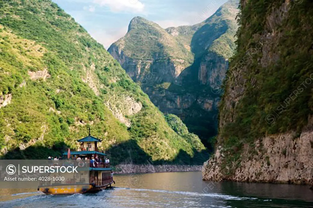 China, Yangtze River, A refurbished traditional river boat sails with tourists and locals down the river.