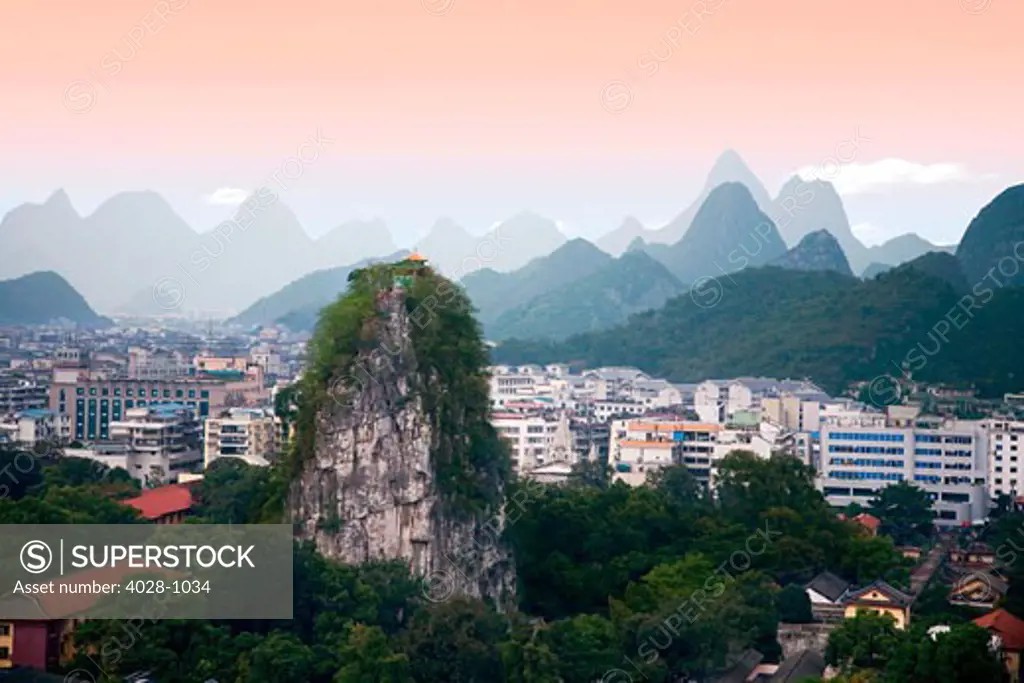 China, Guilin, Fubo Hill slopes into the Li River in the east and looms in the west over the ground.
