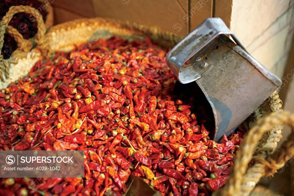 Egypt, Cairo, Souk Market, Hot red peppers with a scoop in them at a vendor selling Spices.