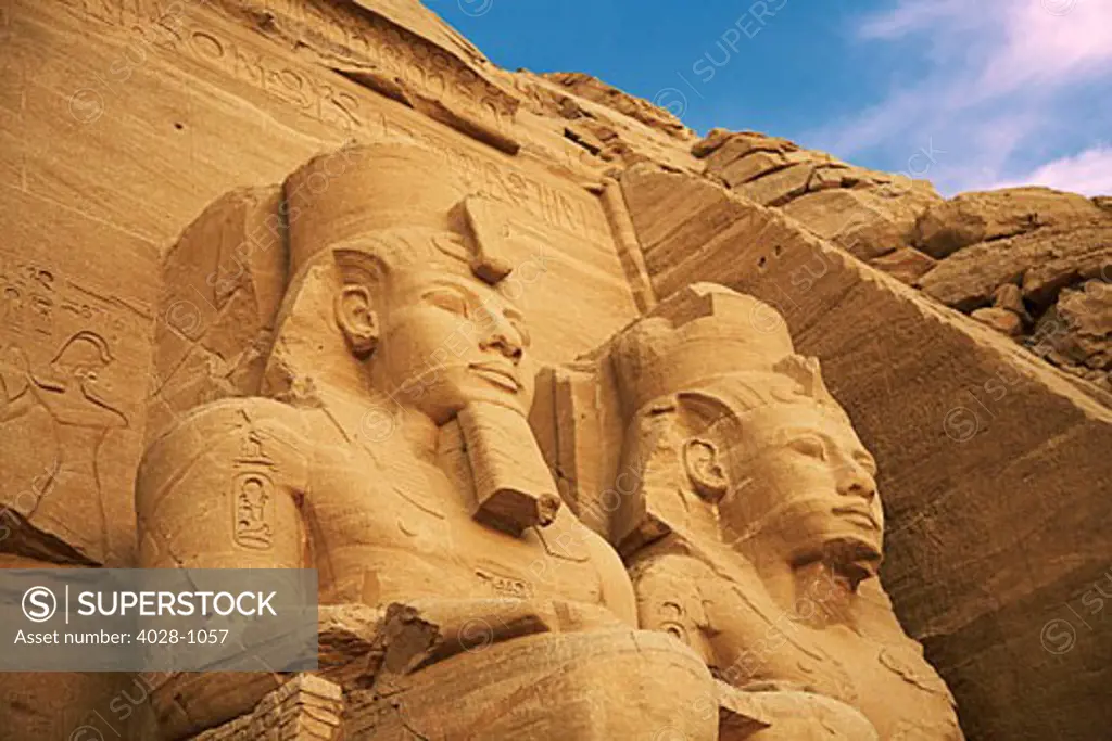 Egypt, Abu Simbel, The Greater Temple of Ramses II, Colossal statues of King Ramesses II near Lake Nasser, Early morning.