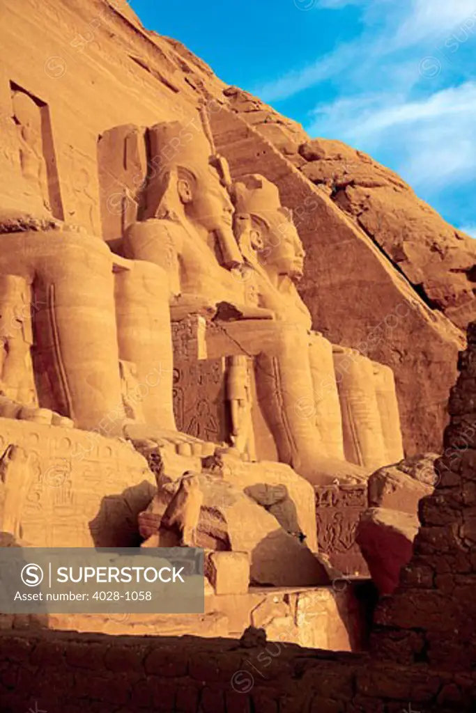 Egypt, Abu Simbel, The Greater Temple of Ramses II, Colossal statues of King Ramesses II near Lake Nasser, Early morning.