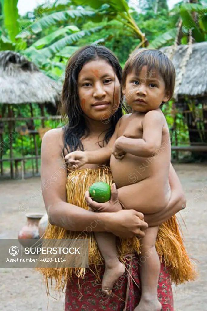 Iquitos, Peru, Amazon Jungle, A Yagua Tribe Woman holds her young son