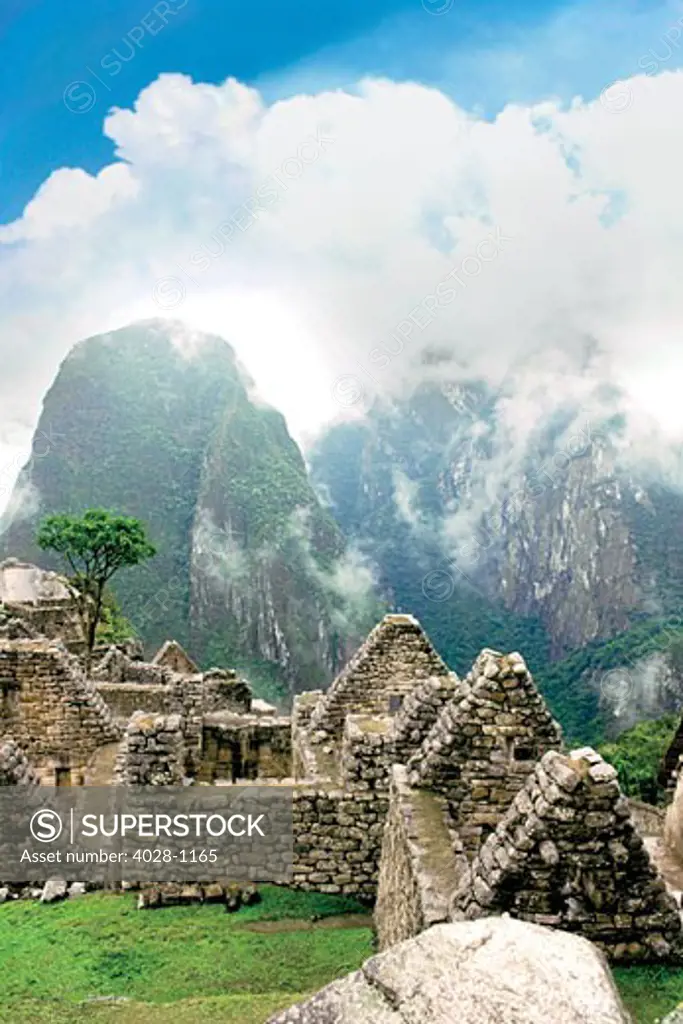 Peru, Machu Picchu, the ancient lost city of the Inca shrouded in mist and clouds.