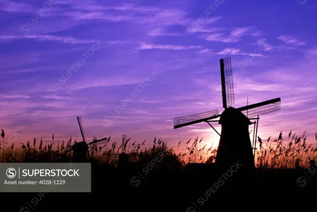 Netherlands, Kinderdijk, Sunsets over the windmills of Kinderdijk