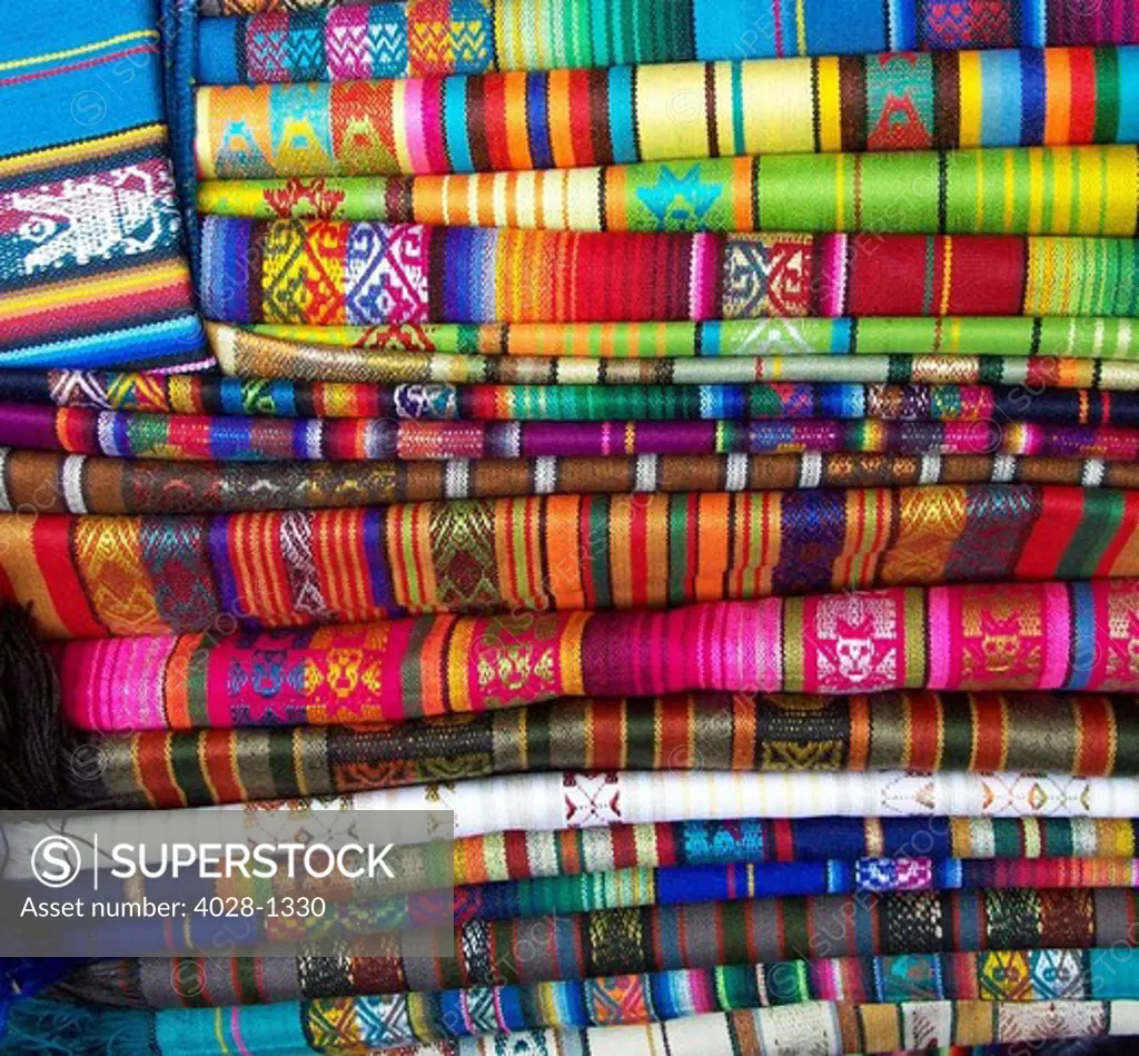 Colorful blankets at indigenous market in Pisac, Peru in the Sacred Valley.