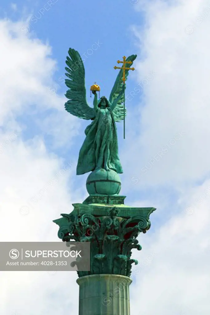 Budapest, Hungary, At the center of Heroes' Square stands the Millennium Memorial with statues of the leaders of the seven tribes that founded Hungary in the 9th century. Archangel Gabriel on its top holding St Stephen's Crown.
