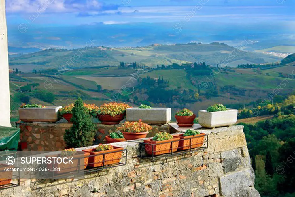 Distant view of the Tuscan landscape from a balcony of a villa outside of San Gimignano, Tuscany, Italy