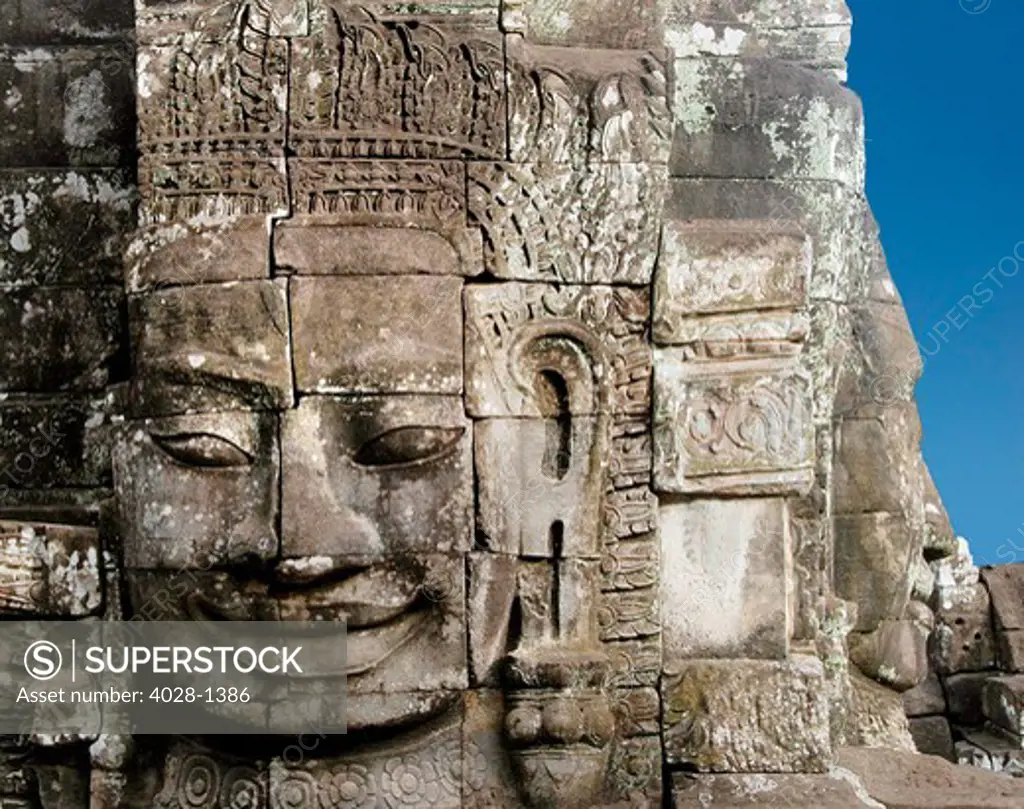 A face tower of The Bayon at Angkor Thom, the largest Khmer city ever built by Jayavarman 7 & 8 a part of the Angkor Wat complex - Siem Reap, Cambodia