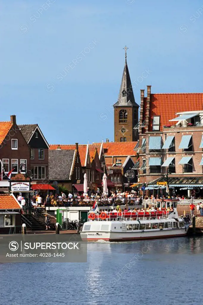 Netherlands, Edam-Volendam, View of the harbor, and the Reformed Church Spire in the background.