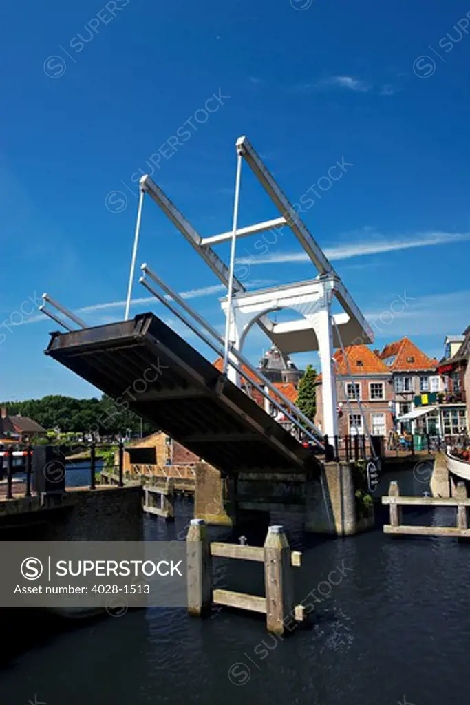 Netherlands, Enkhuizen, Draw bridge and Classic Dutch vessels in the canal.