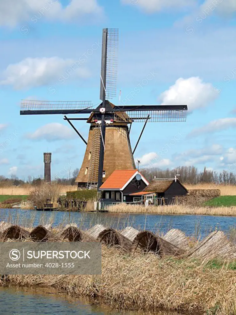 Netherlands, Kinderdijk, An ancient windmill still working.