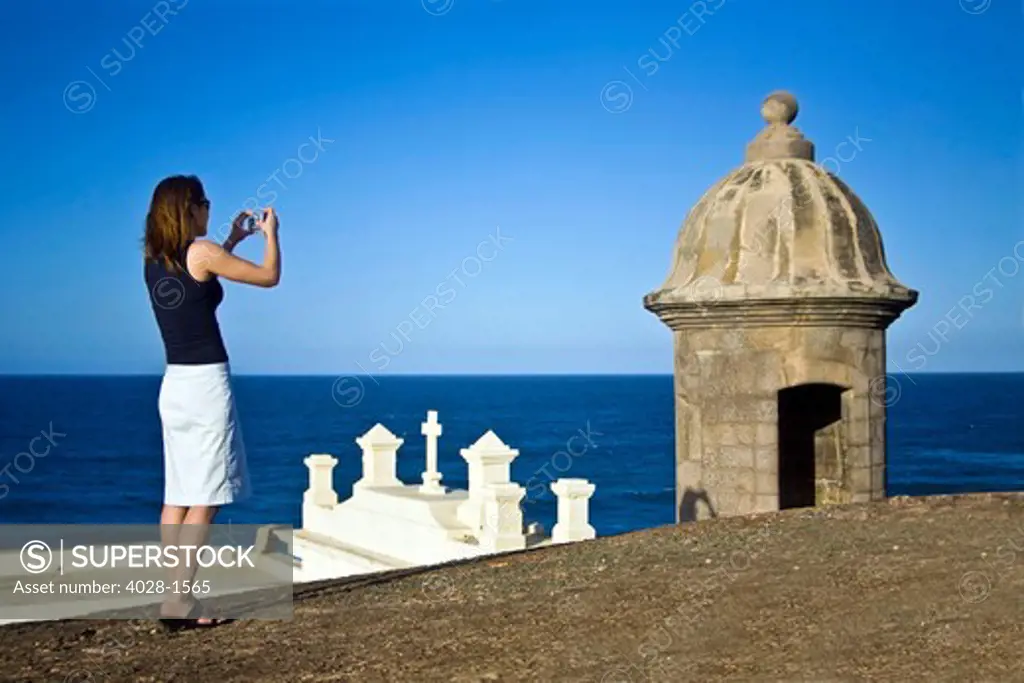 El Morro fortress and Church. Old San Juan. Puerto Rico. Woman taking a photo.
