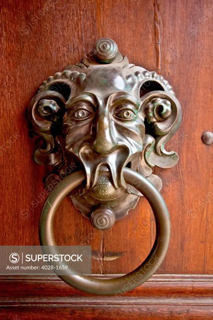 Durnstein, Wachau Valley, Austria, Ornate gargoyle door knocker on a traditional wooden door in the old town district