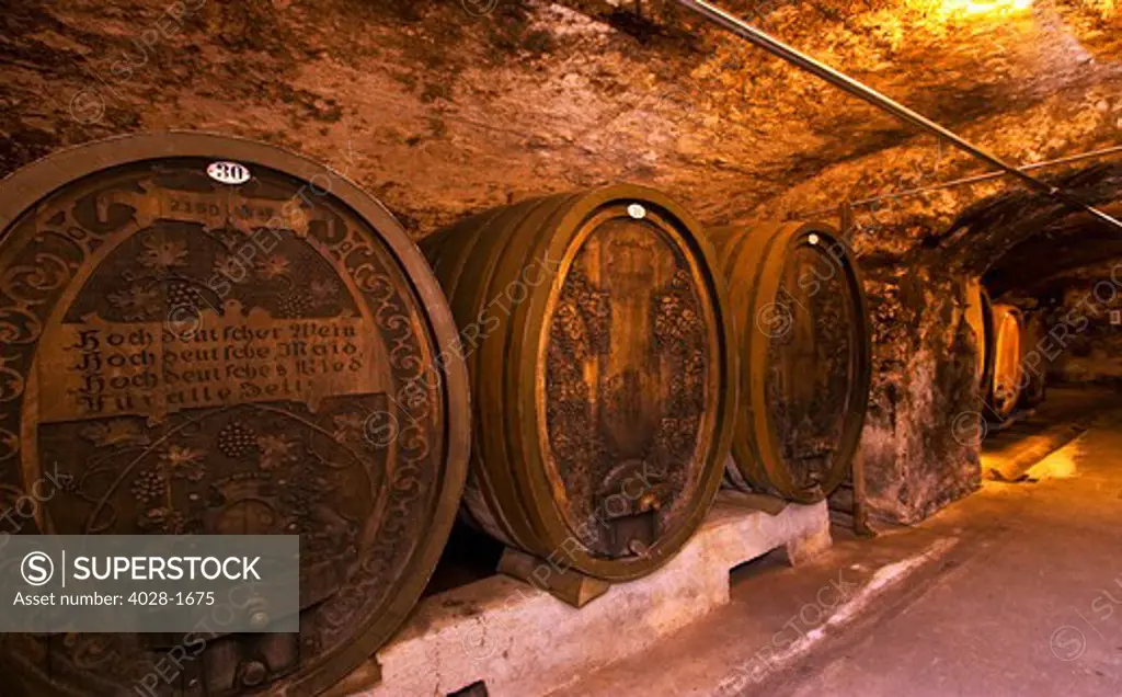 Wurzburg, Bavaria, Germany, Ornate wine barrels at the Staatlicher Hofkeller wine cellar at the Wurzburg Residenz inscribed with a German toast: