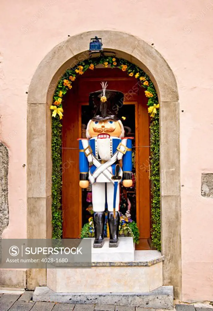 Rothenburg ob der Tauber, Germany, a life-sized nutcracker soldier on display during the Christmas holiday season in an alcove