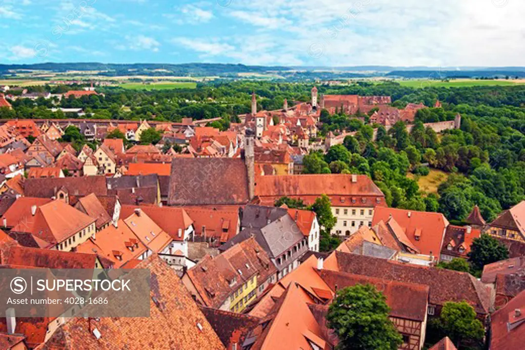 Rothenburg ob der Tauber, Bavaria, Germany, A view over the rooftops of the 13th century Medieval town complete with city walls, towers and gates.
