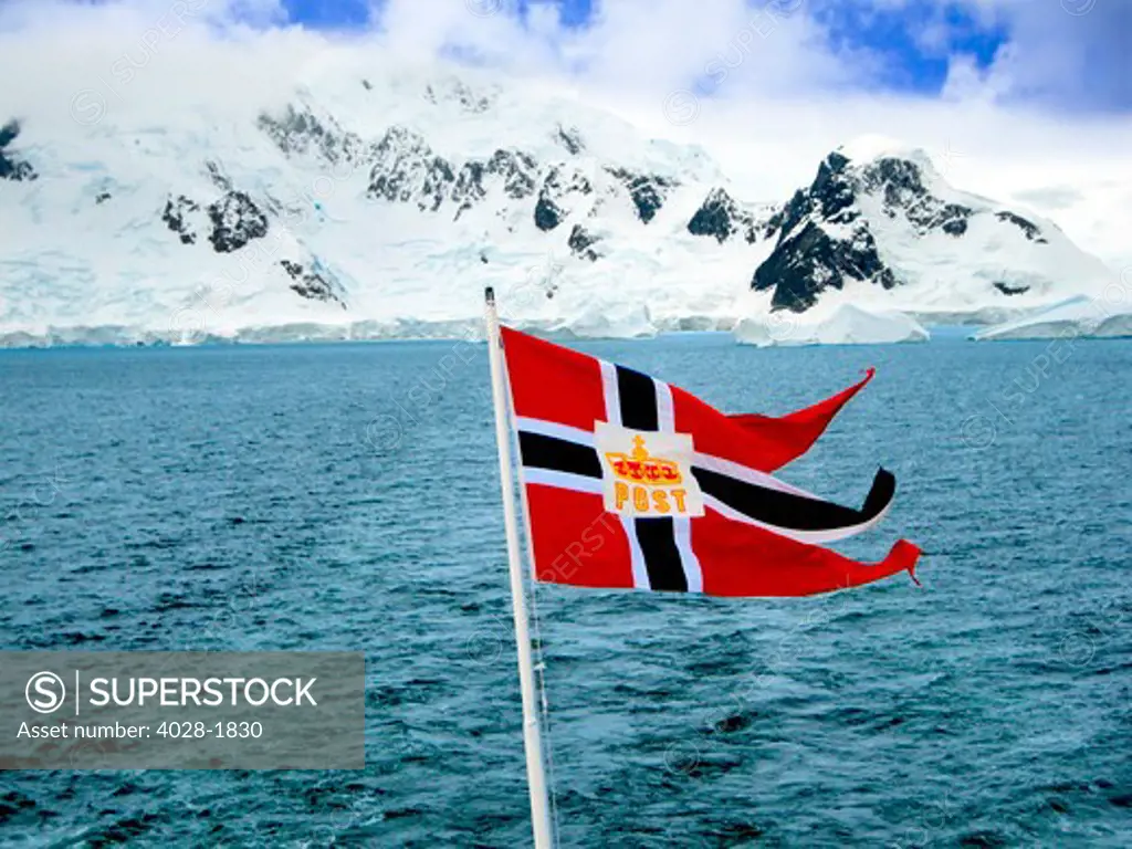 A Hurtigruten Cruise Ship postal service flag is displayed while cruising the Weddell Sea in Antarctica.