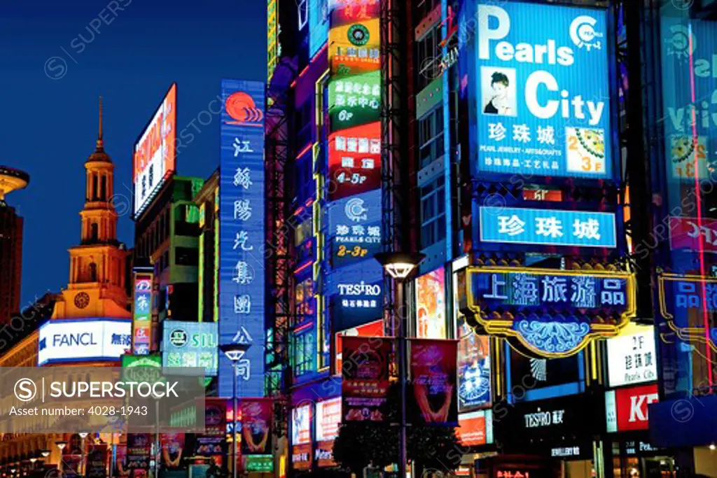China, Shanghai, Nanjing Road, The neon signs along the shopping and business center at night.