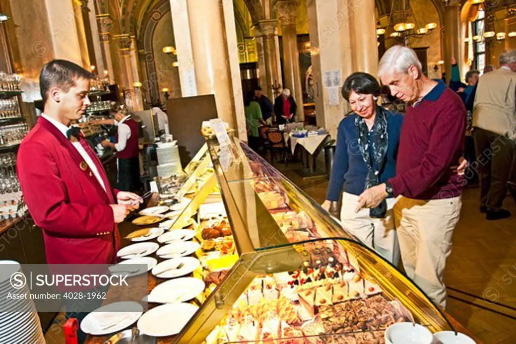 Vienna, Wien, Austria, tourists choose from assorted desserts at Cafe Central