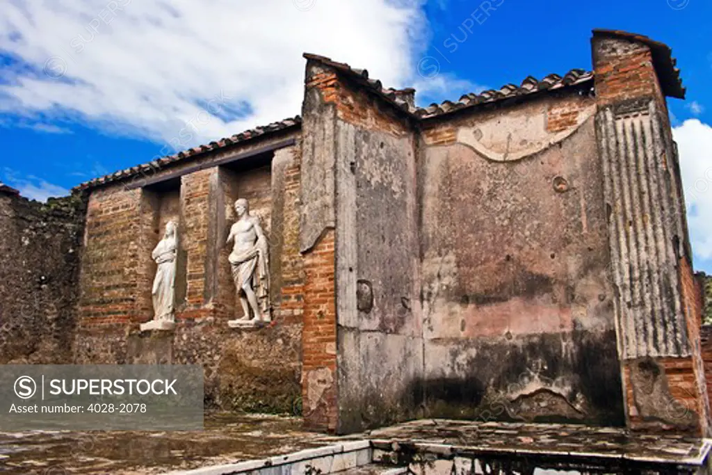 Roman marble statues of the bath house amoung the ancient ruins of Pompeii, Italy, Campania, near Naples
