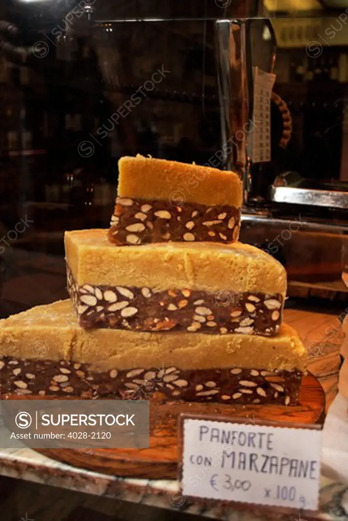 Panforte with Marzapane cakes in a bakery window in Florence, Tuscany, Italy, Europe