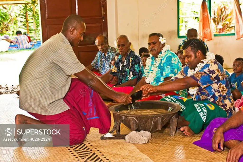 Navua, Fiji, native men and boys perform a traditional Kava tea ceremony