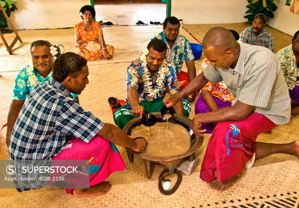 Navua, Fiji, native men and women perform a traditional Kava tea ceremony