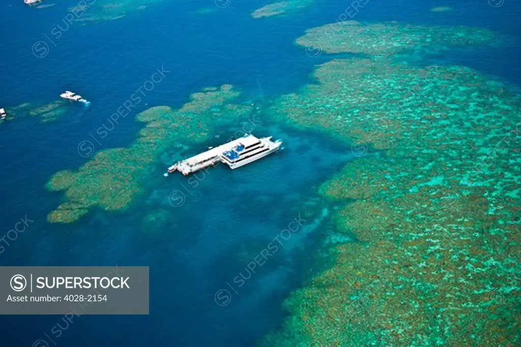 Aerial view of a tour boat docked at a pontoon at the Great Barrier Reef, Queensland, Australia