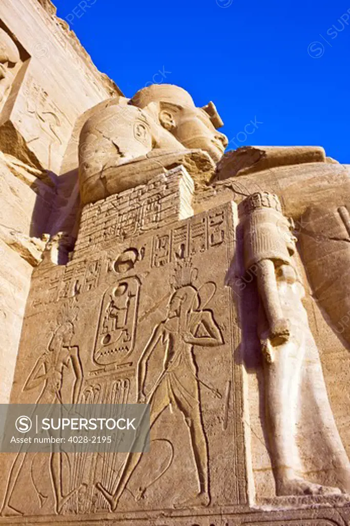 Egypt, Abu Simbel, The Greater Temple of Ramses II, Colossal statues of King Ramesses II near Lake Nasser.