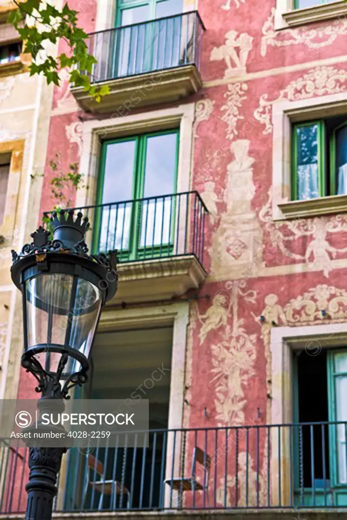 Barcelona,Catalonia,Spain,Ornate street lamp and balcony creating the atmosphere of the Gothic Quarter.