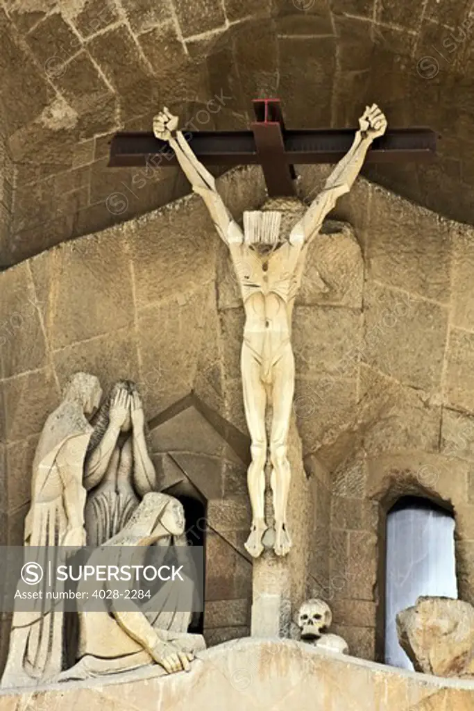 Barcelona, Catalonia, Spain, statues and stonework of  the Passion Facade of  the Temple of Sagrada Familia, by architect Josep Maria Subirachs. The crucifixion of Jesus Christ