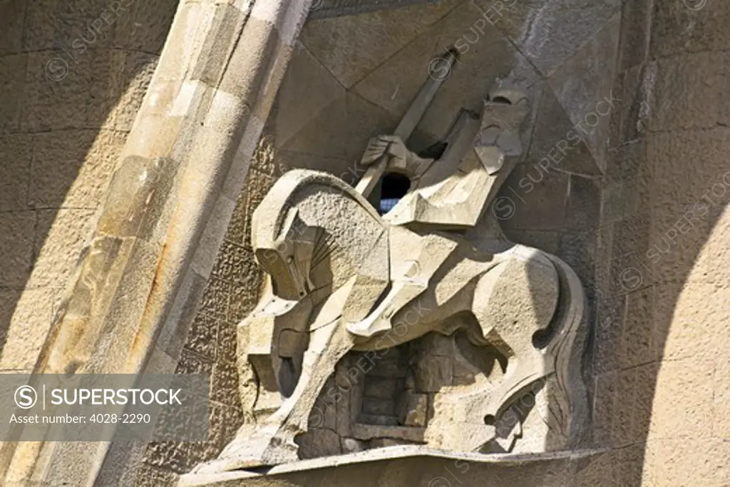 Barcelona, Catalonia, Spain, statues and stonework of  the Passion Facade of  the Temple of Sagrada Familia, by architect Josep Maria Subirachs. Longinus, the soldier who put his lance in Christ's side.