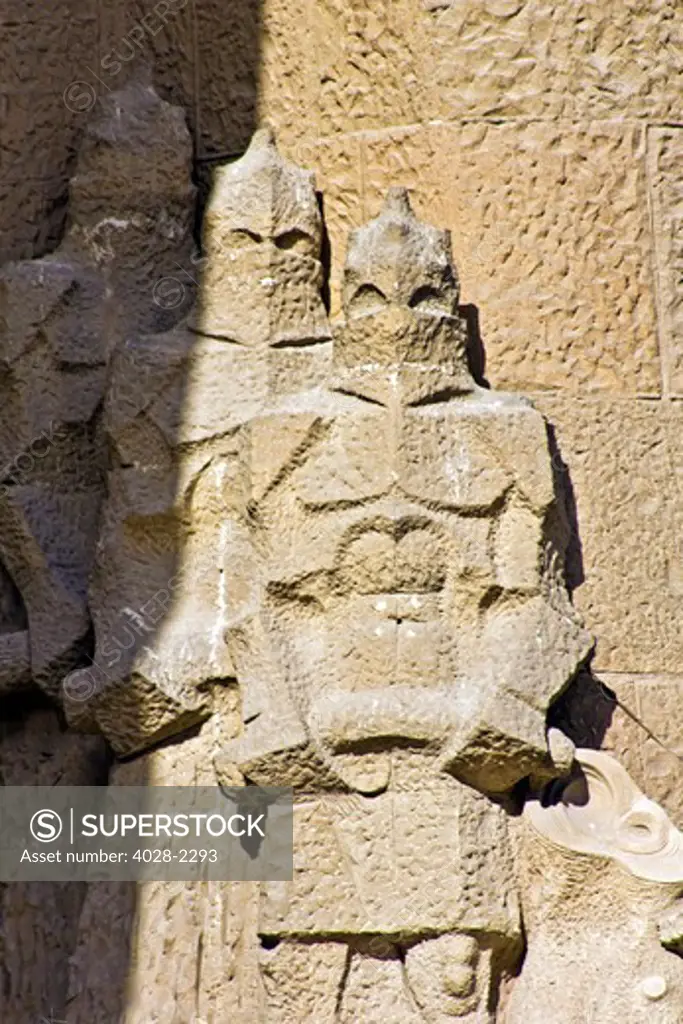 Barcelona, Catalonia, Spain, statues and stonework of  the Passion Facade of  the Temple of Sagrada Familia, by architect Josep Maria Subirachs. The Roman guards.