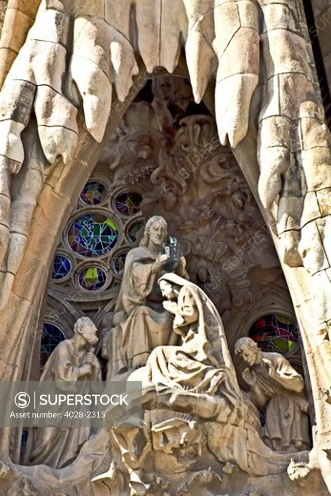 Spain, Catalonia, Barcelona, Sagrada Familia, statues and stonework of  the Nativity facade (Gaudi architect). The correnation of Mary.
