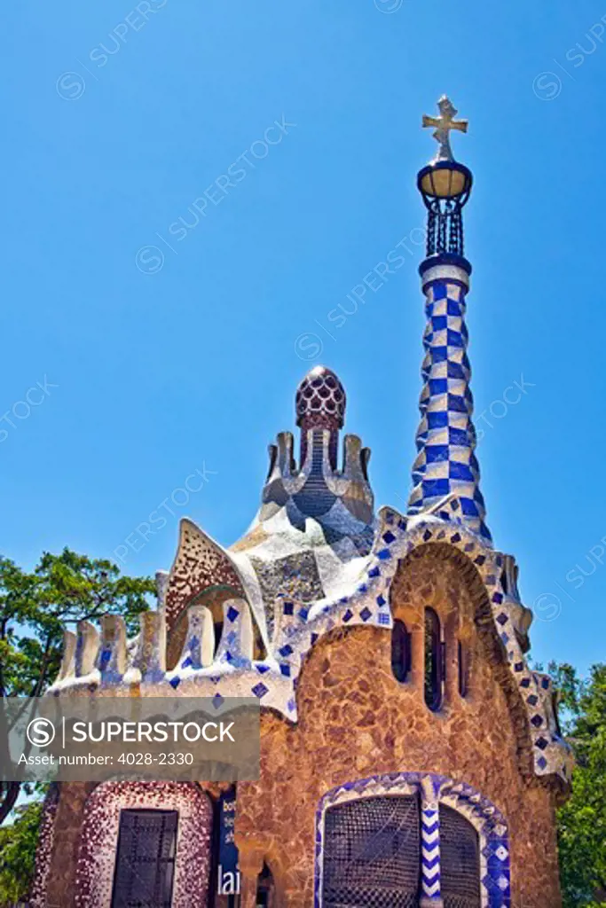 Barcelona, Catalonia, Spain, Detail of  a multi-coloured tiled mosaic Fanciful House in Guell Park by Antonio Gaudi.