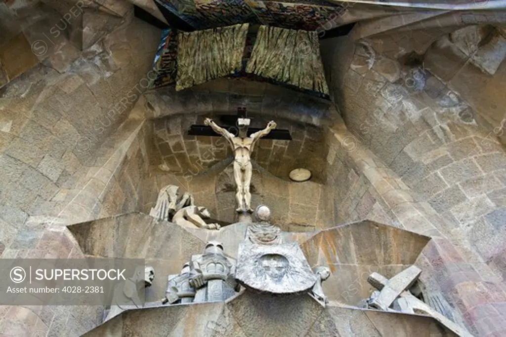 Barcelona, Catalonia, Spain, statues and stonework of  the Passion Facade of  the Temple of Sagrada Familia, by architect Josep Maria Subirachs. The calvery and Crucifixion of Jesus Christ