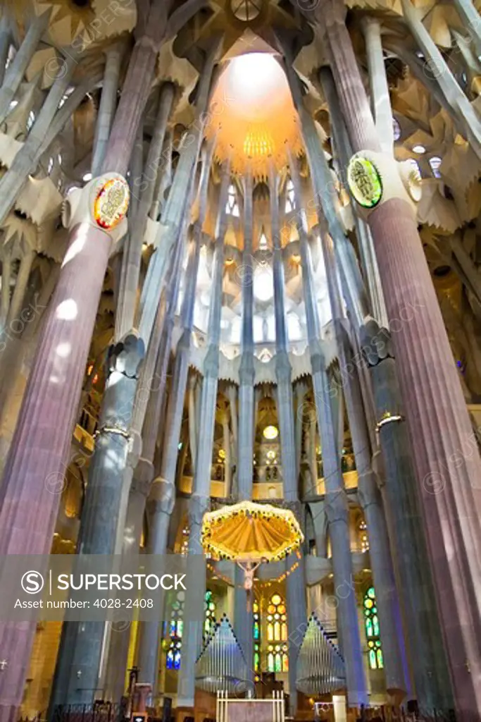 Barcelona, Catalonia, Spain, ornate alter, stained glass window, column and ceiling of the Interior of Sagrada Familia