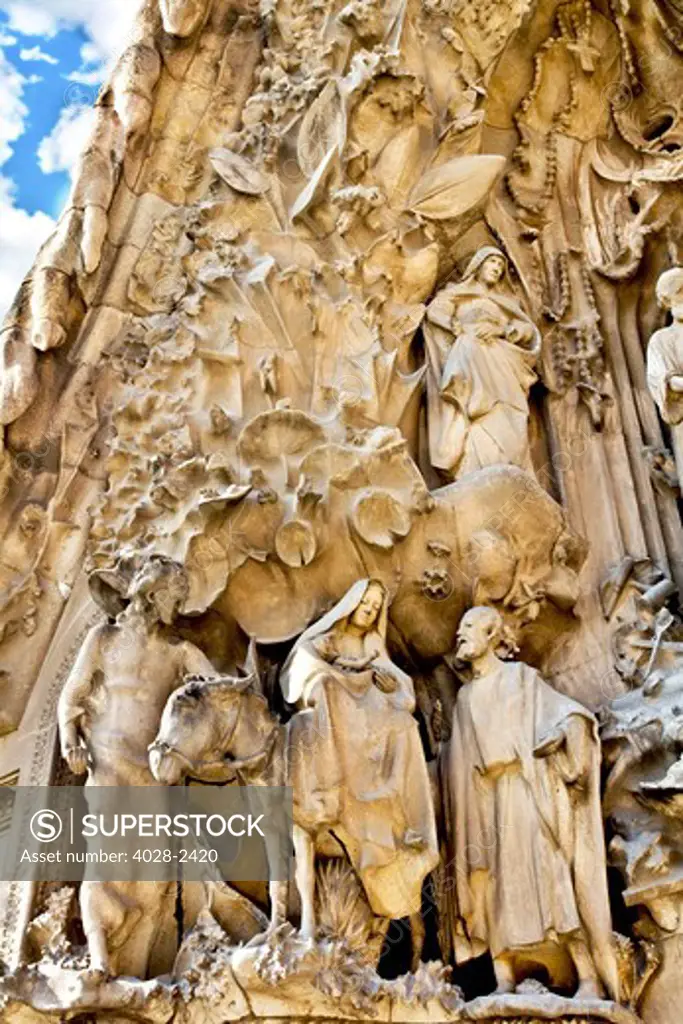 Spain, Catalonia, Barcelona, Sagrada Familia, statues and stonework of  the Nativity facade (Gaudi architect). Mary, Joseph and baby Jesus.