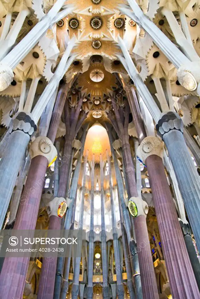 Barcelona, Catalonia, Spain, ornate vault, stained glass window, column and ceiling of the Interior of Sagrada Familia