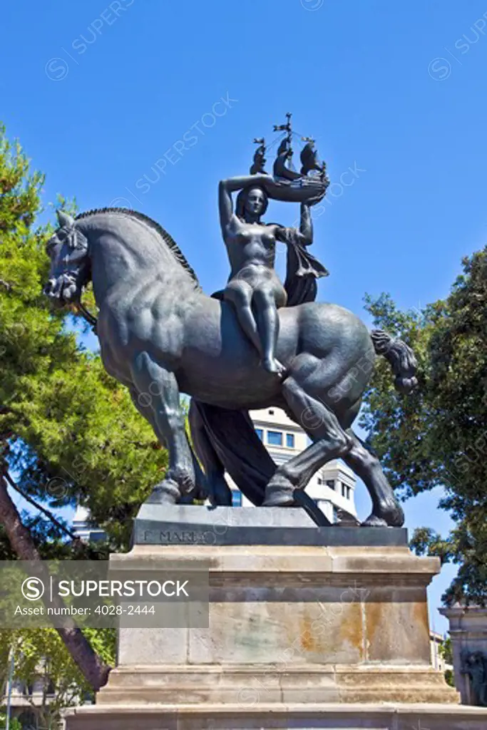 Barcelona, Catalonia, Spain, bronze sculpture of a woman on a horse holding a model ship at the Placa de Catalunya by F. Mares.