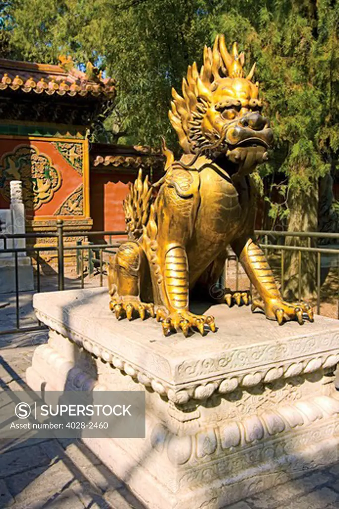 China, Beijing, Forbidden City, Imperial Garden, Gate of Divine Might, Gilded bronze guard lion guarding the Gate.