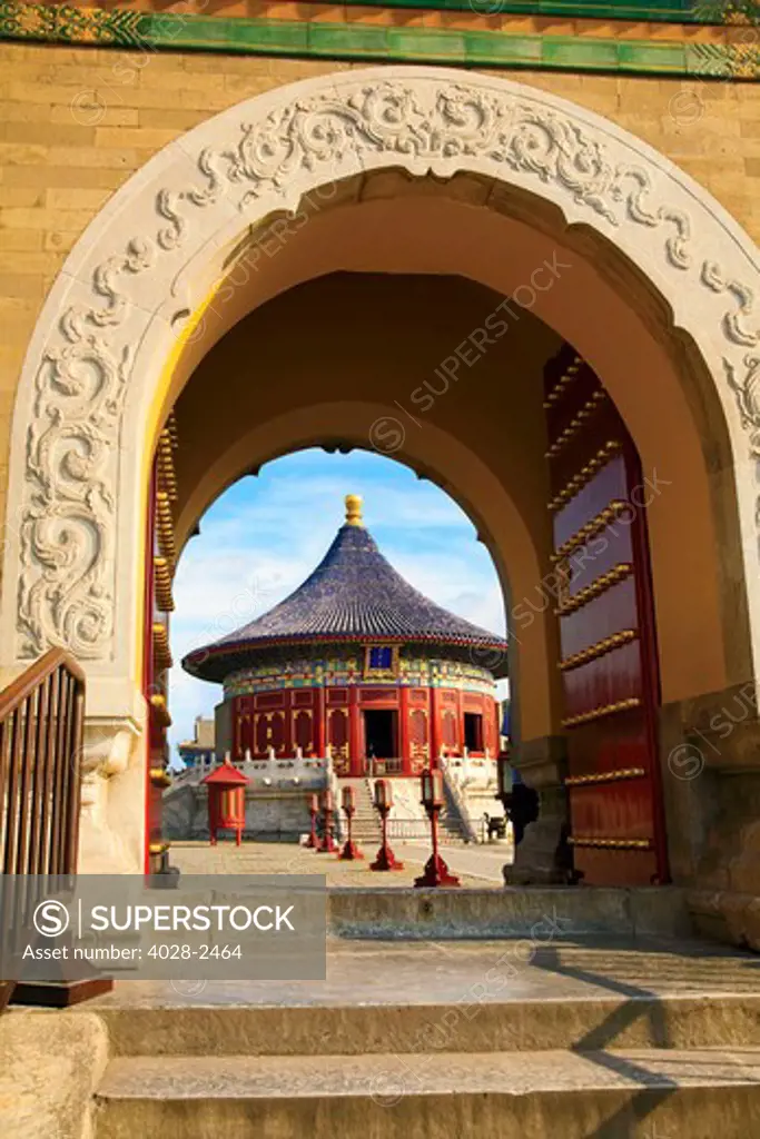 China, Beijing, Tian Tan Park, Temple of Heaven, The Imperial Vault of Heaven lined with lanterns seen through arch.