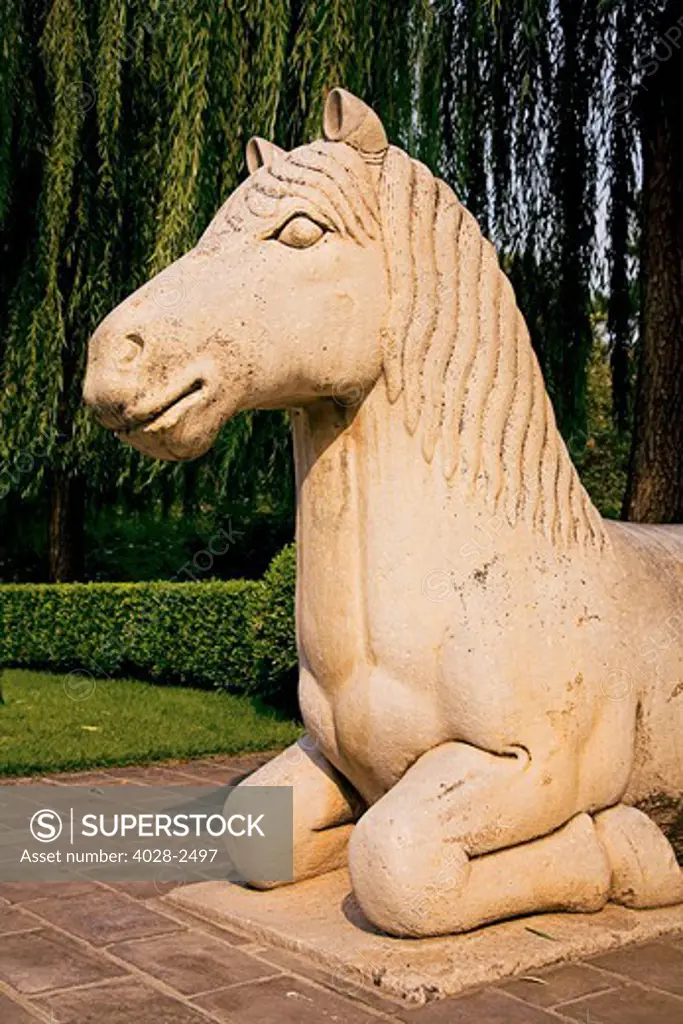 China, Beijing, Ming Dynasty Tomb, Spirit Way, A stone statue of an ancient horse along the avenue.