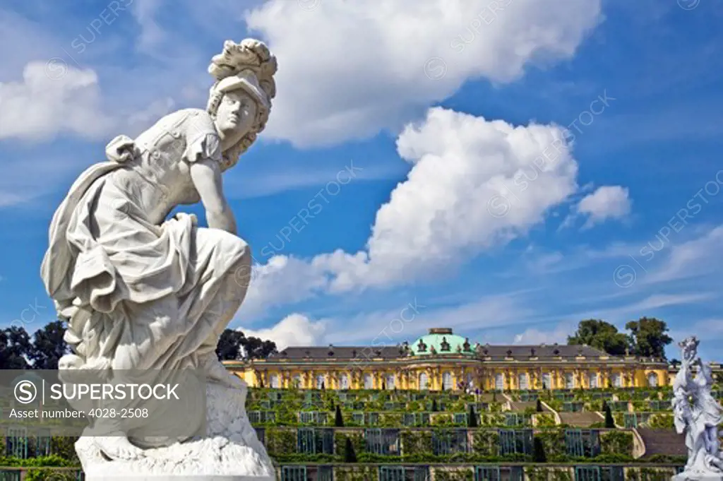 Germany, Brandenburg, Preussen, Potsdam, A statue of the Greek goddess Minerva next to the terraced gardens in front of main facade of Sans Souci Palace.