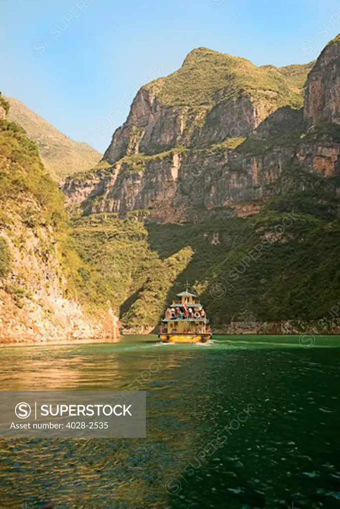 China, Yangtze River, A traditional river boat sails with tourists and locals down the river.