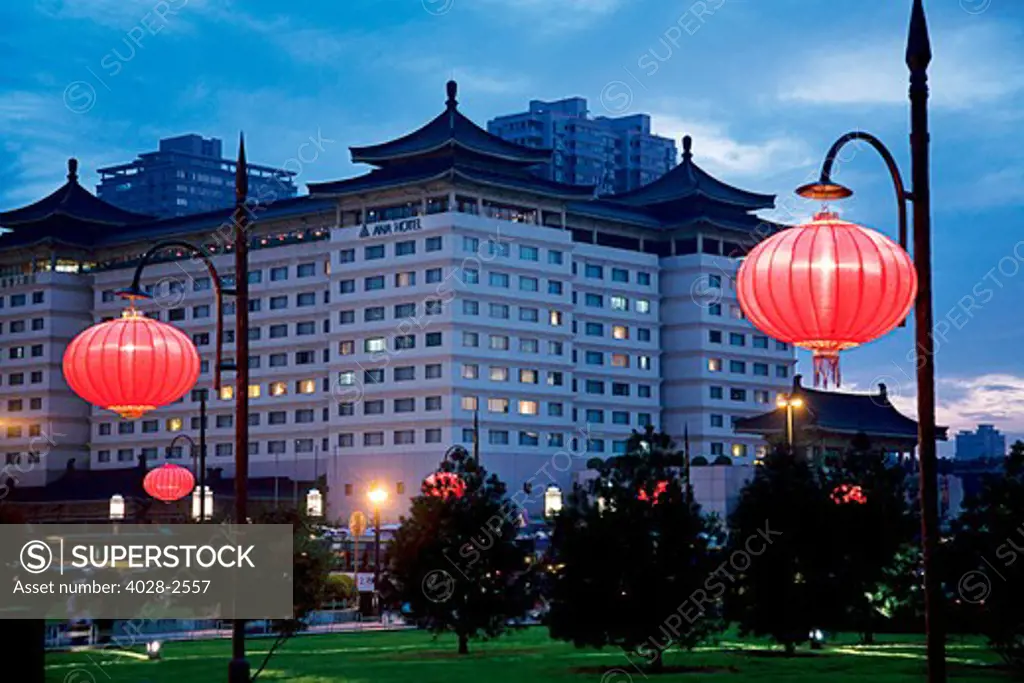 China, Xi'an, ANA Grand Castle Hotel, Traditional red Chinese lanterns are aglow in front of the hotel near the Xi'an City Wall.